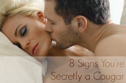 Man kissing on woman's cheek in bedroom